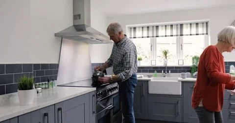 Elderly Couple in the Kitchen Cooking Stock Footage 79582832