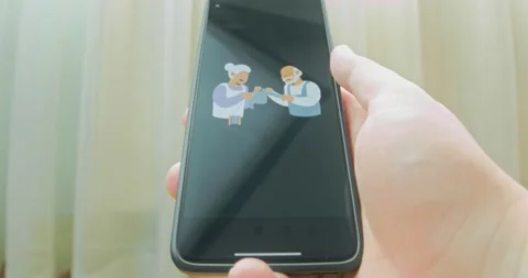 Elderly couple knitting clothes, presentation Vídeo Stock 313500446