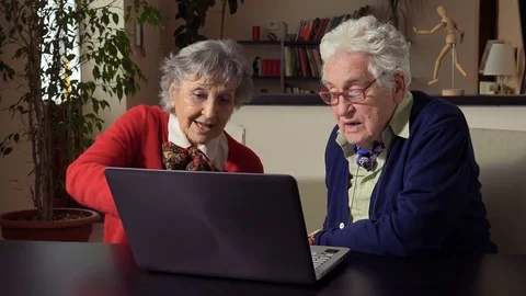 Elderly couple learn to use computers: senior age, computer science, learning Video stock 84188670