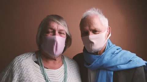 Elderly couple looking to the camera Stock Footage 146437834