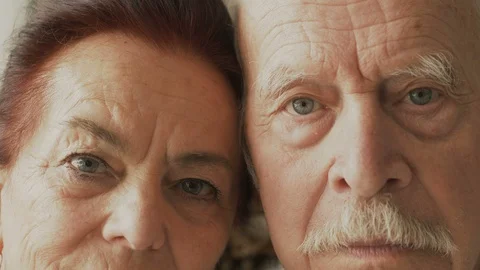 Elderly couple looking at the camera with serious look, closeup Stock Footage 116326166
