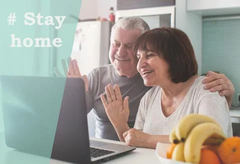Elderly couple looking at computer during the pandemic coronavirus Stock Photos