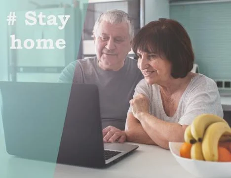 Elderly couple looking at computer during the pandemic coronavirus Stock Photos