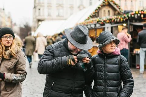 An elderly couple is looking at a map. Stock Photos