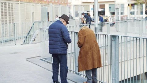 Elderly couple looking for something in a bag with products Stock Footage 101269326