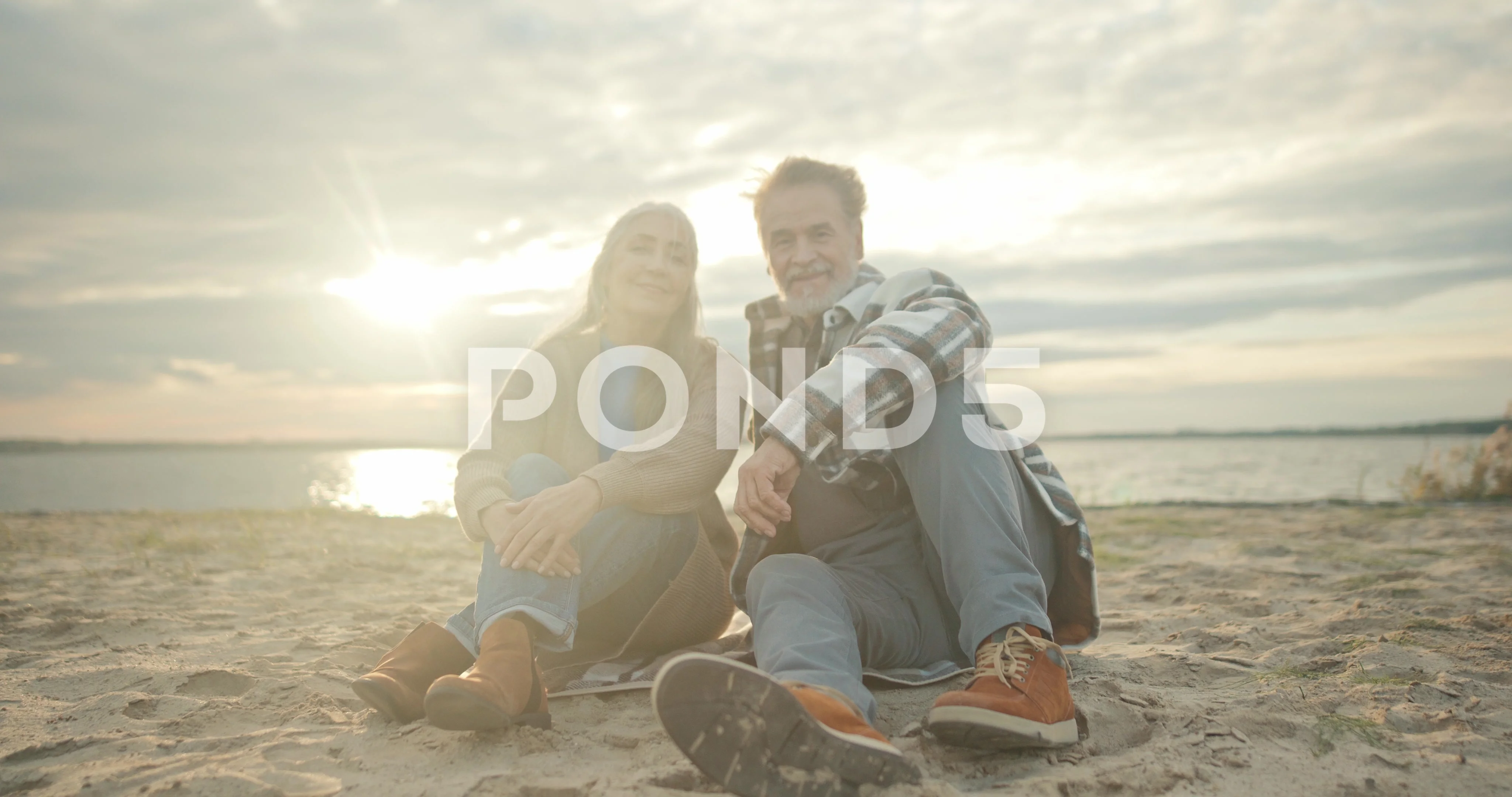 Senior couple posing on studio white background Stock Photo - Alamy
