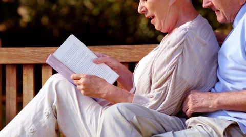 Elderly couple reading a book Video stock 24770181