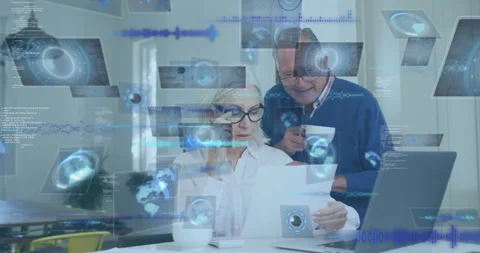 Elderly couple reviewing documents with digital data processing animation Stock Footage 306243773