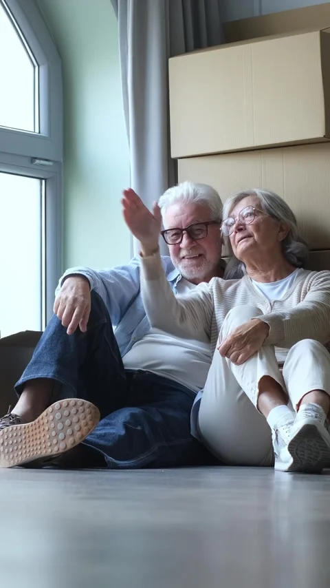 Elderly Couple Sits on Floor 스톡 동영상 332684777