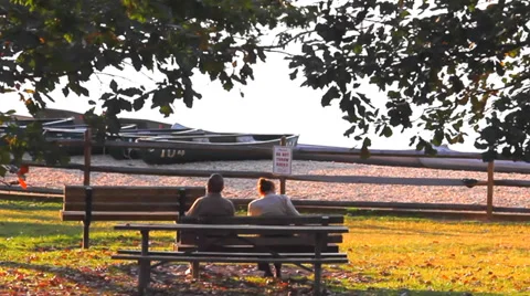 Elderly Couple Sitting on Bench Stock Footage 37826522