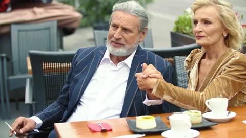 Elderly couple sitting at the table Stock Footage 141609564