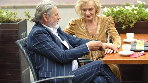 Elderly couple sitting at the table Stock Footage 143344515