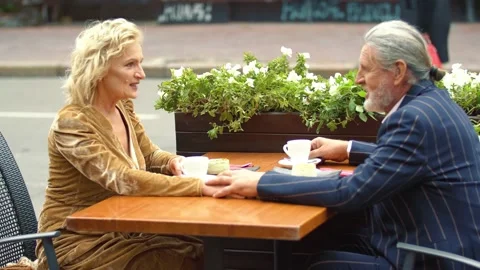 Elderly couple sitting at the table Stock-Footage 143691275