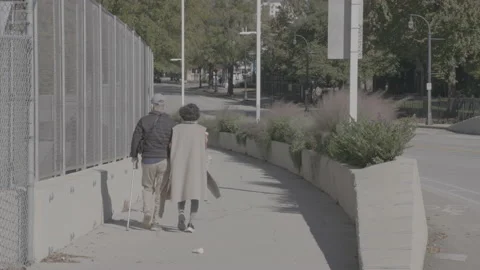 Elderly Couple Walking down Sidewalk 4K Stock Footage 148178900