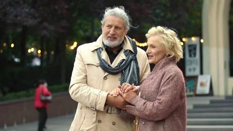 Elderly couple walking on the street Stock Footage 141841053