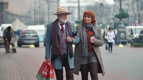Elderly couple walking the streets Stock Footage 147676812