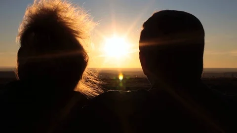 Elderly couple watching the sunset Stock Footage 98051283