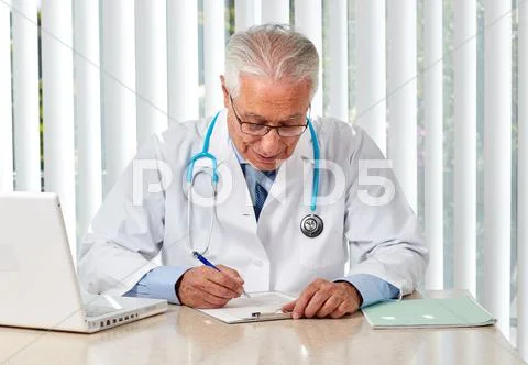 Elderly Doctor Man In Hospital.