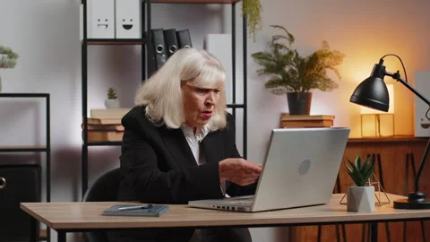 Elderly employer freelancer using laptop working at home office having nervous Stock Footage 311601670