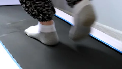 Elderly feet walking on a treadmill. Stock Footage 341109701
