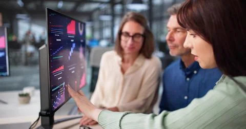 Elderly Financial Advisor Analyzing Analytics Data On Corporate PC Stock Photos
