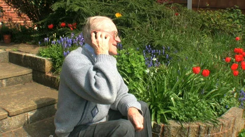 Elderly gentleman on a mobile Stock Footage 368806