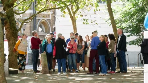 Elderly group given a walking tour in London Stock Footage 285078979