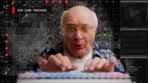 Elderly hacker tracing sim card activity, typing on keyboard, digital espionage 스톡 동영상 307196190