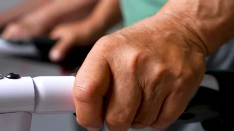 Elderly hand gripping a treadmill handle. Stock Footage 341109612