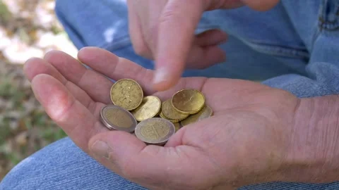 Elderly hands counting coins side view financial concern Stock Footage 333194633