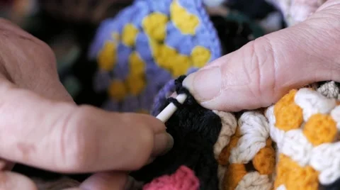 Elderly hands do move the needle for wool Stock Footage 59836167