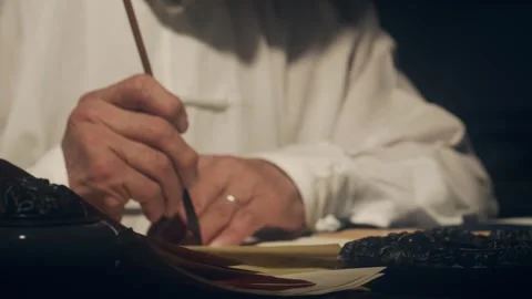 Elderly Hands Writing Calligraphy with Brush Pen on Paper 库存影片 334646590