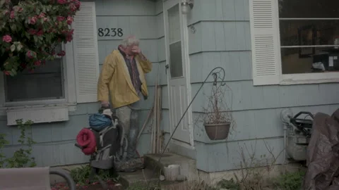 Elderly hiker returning home with backpack arriving at front door Stock Footage 331657762