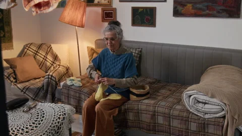 Elderly Lady Knitting While Watching TV Video stock 314622433