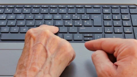 An elderly lady learns to use the computer Stock Footage 122943800