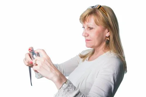 Elderly lady using a compact camera Stock Photos