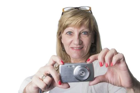 Elderly lady using a compact camera Stock Photos