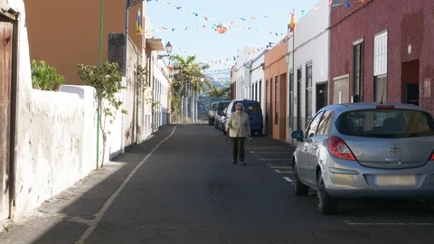 Elderly Lady Walking In Small Town Garachico Tenerife Spain street view Stock Footage 104546239