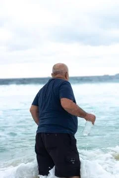 Elderly man on the beach Stock Photos
