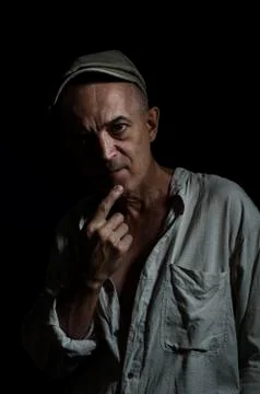An elderly man in a cap. Stock Photos