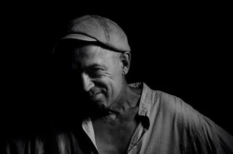 An elderly man in a cap. Stock Photos