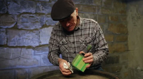 Elderly man cleaning coffee grinder Stock Footage 45177720