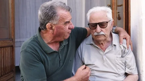 Elderly man console his sad old friend Stock Footage 81152483