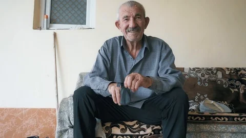 Elderly man on couch closeup Stock Footage 95679426