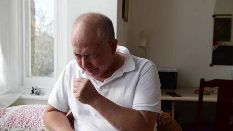 Elderly man coughing. Stock Footage 231990232