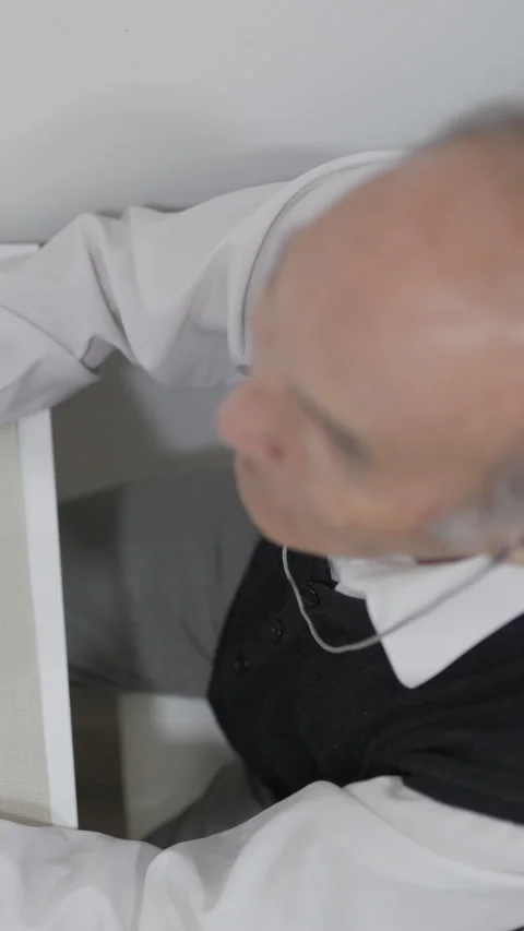 Elderly man eating biscuits at table Stock Footage 327231121