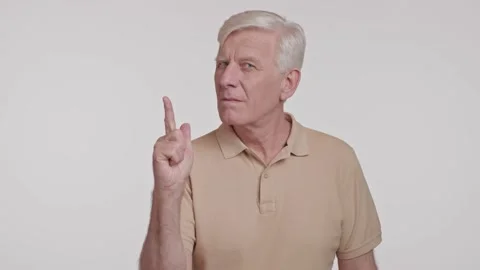 An elderly man is gesturing with his finger pointing up Stock Footage 266922217