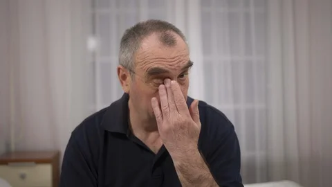 Elderly man with glasses, vision problems. close-up Stock Footage 106245675