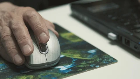 Elderly Man Hand Using A Wireless Computer Mouse On Desk Stock Footage 99927331