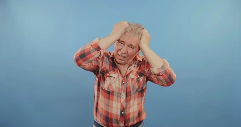 Elderly man has a headache Stock Footage 114127868